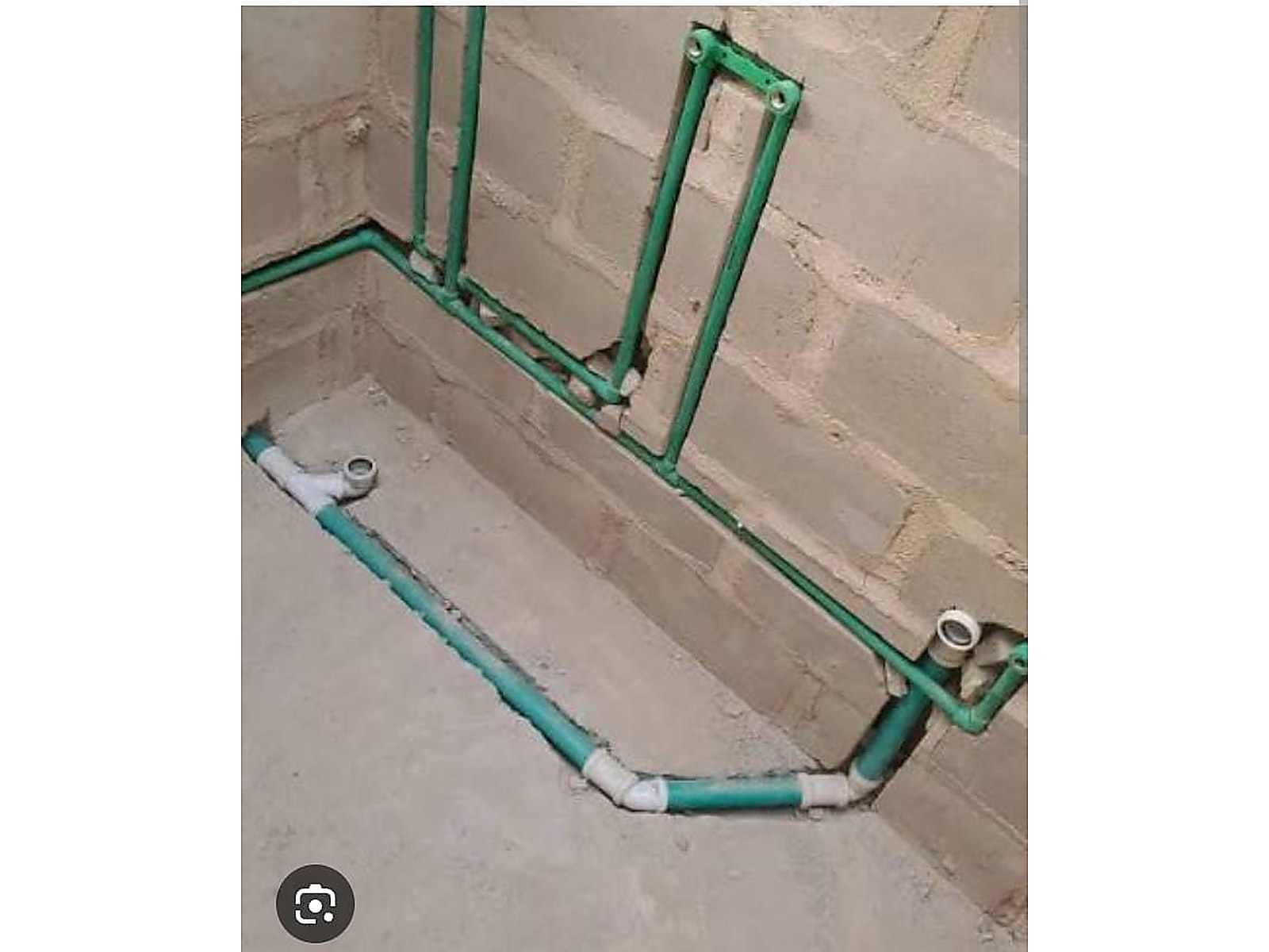 Plumbing repair project: new pipe routing and fittings